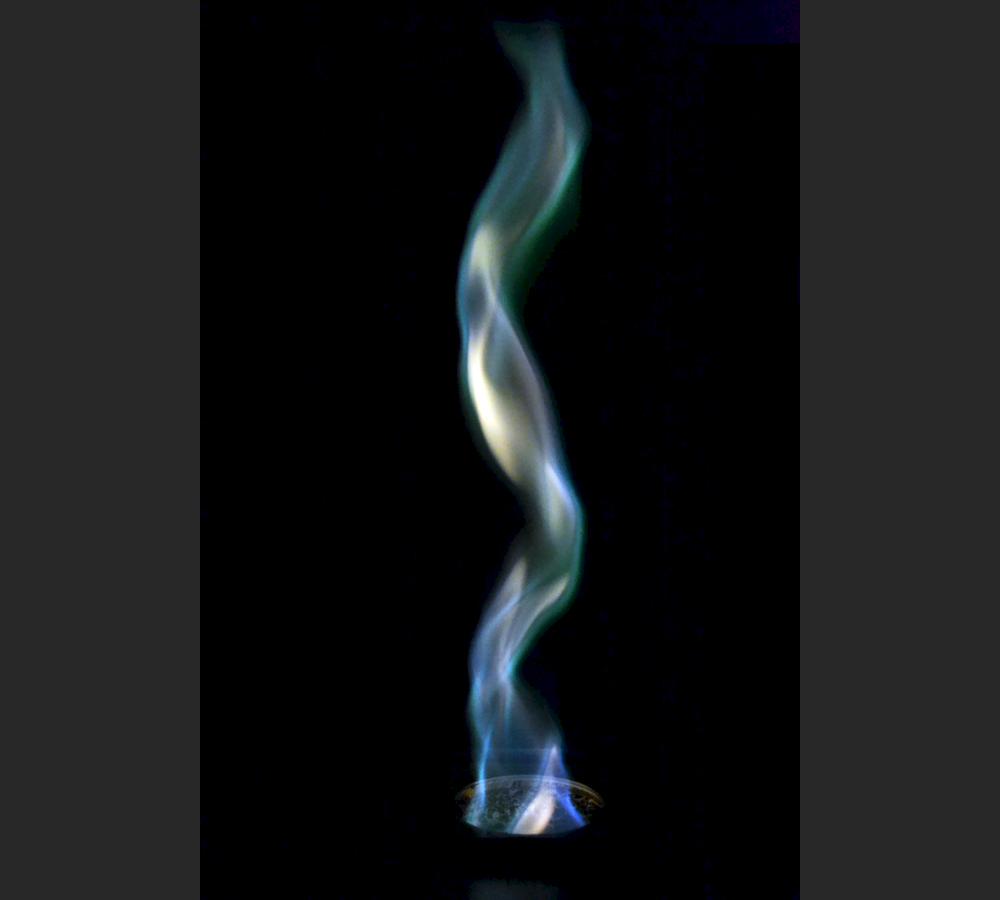 A fire whirl in a Tempest Table Top Torch, colored by \u0026#39;Rainbow Crystals\u0026#39;: Copper Sulfate ...